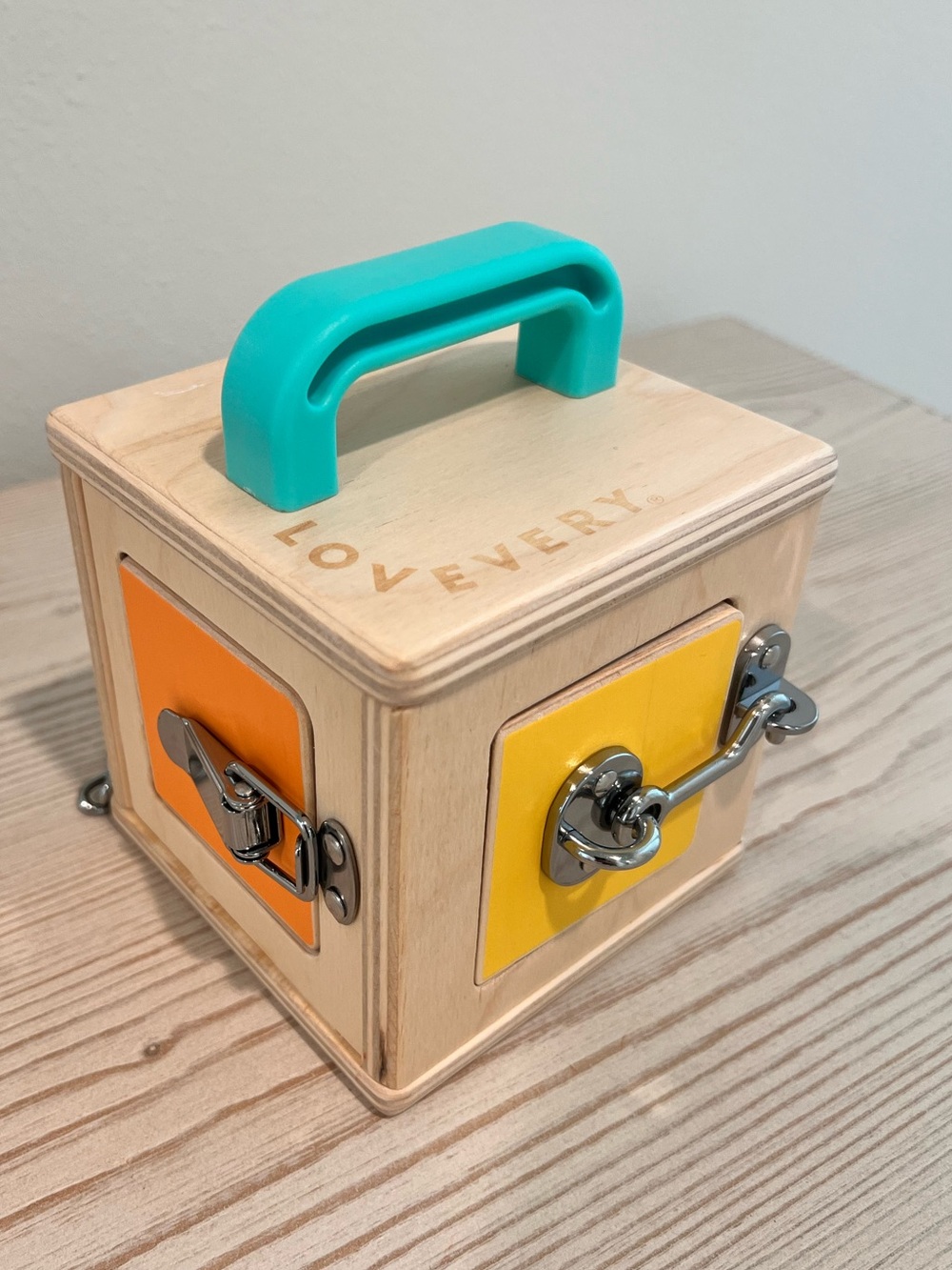 Lovevery Montessori Wooden Lock Box Toy - Teal Handle with Yellow & Orange Panel